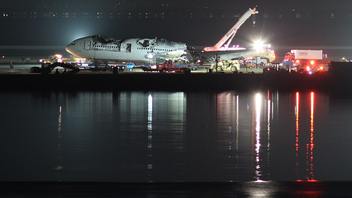 The wreckage of the Asiana Airlines Boeing 777 at San Francisco International Airport during its removal.