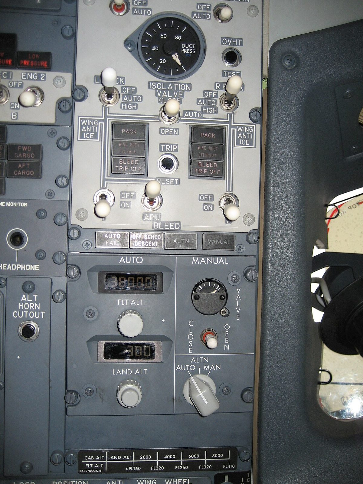 Cabin pressure and bleed air control panels on the overhead panel of a Boeing 737-800.