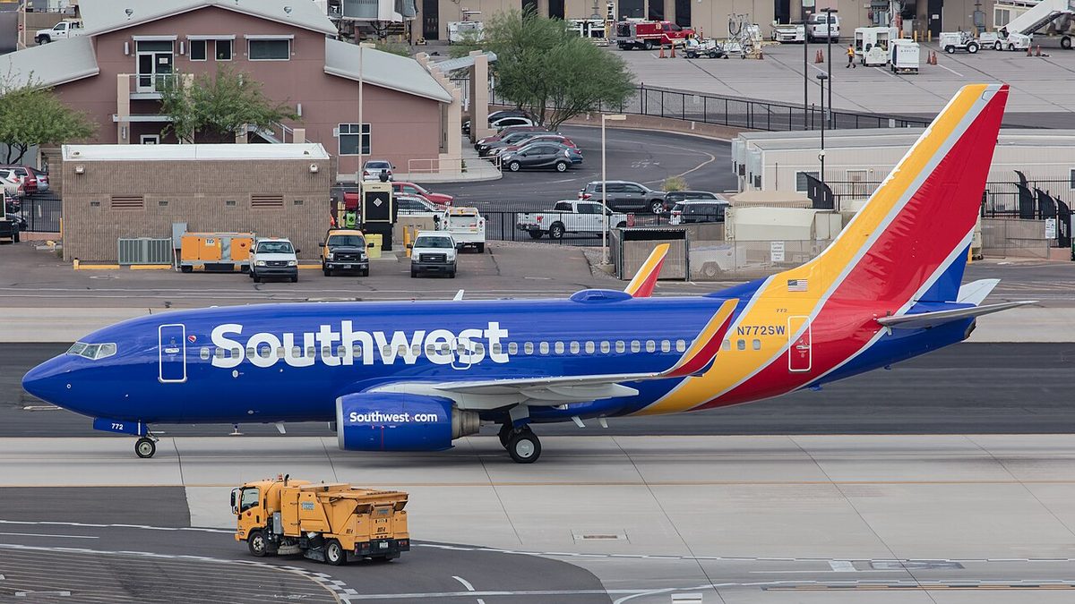 A Southwest Airlines Boeing 737-700 registered N772SW on the ground at Phoenix Sky Harbor International Airport.