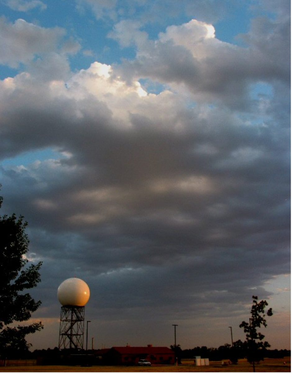 A layer of mid-level cloud with small turret-shaped tops rising from it.