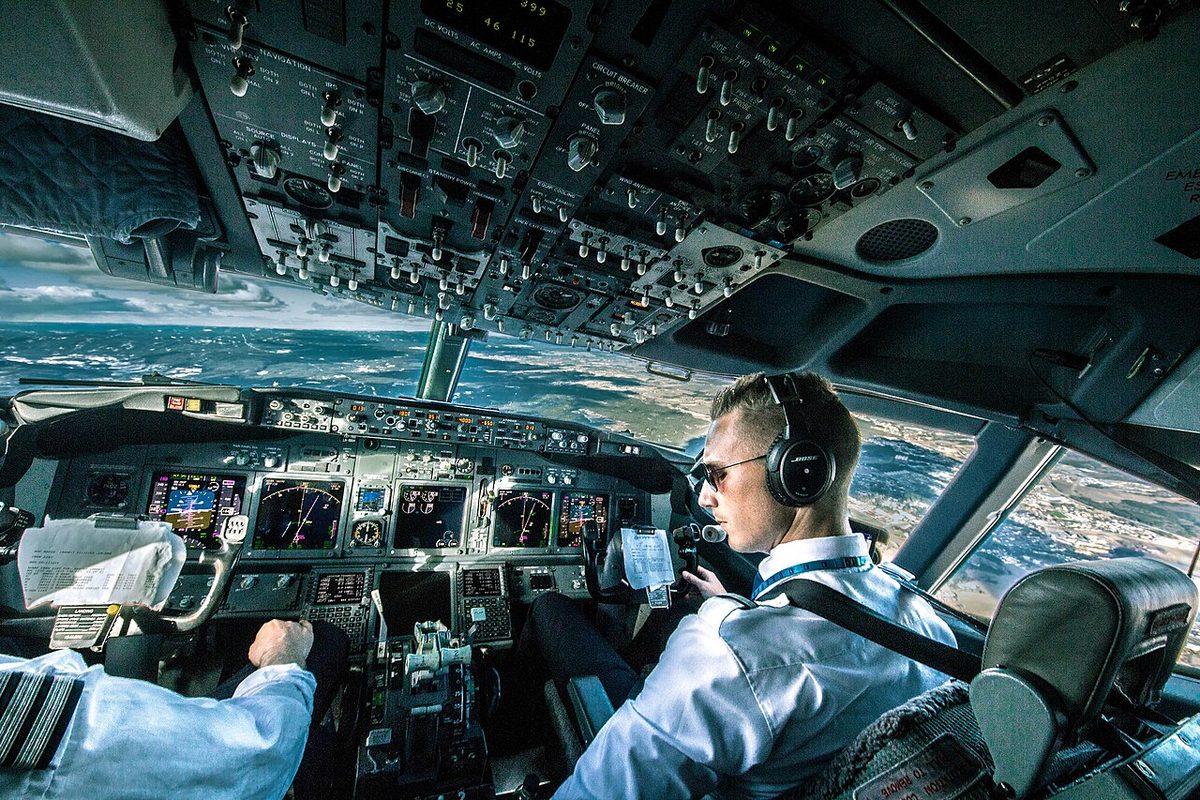 Pilots on the flight deck of a Boeing 737 in flight.