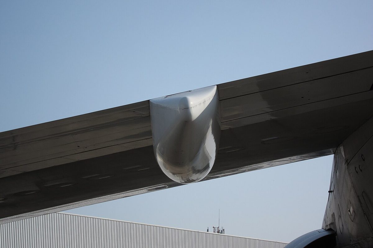 A streamlined fairing under the trailing edge of an airliner's wing.