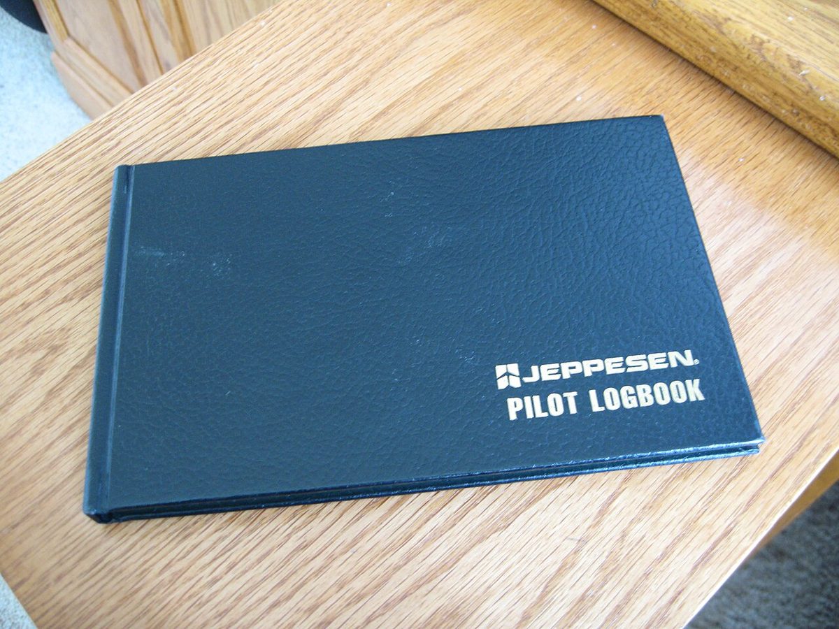 The cover of a pilot's flight logbook.