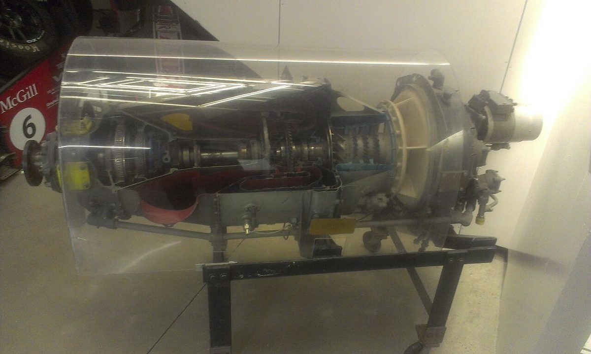 A sectioned turboprop engine on display, with its compressor, combustion section, turbines and propeller reduction gearbox cut open.