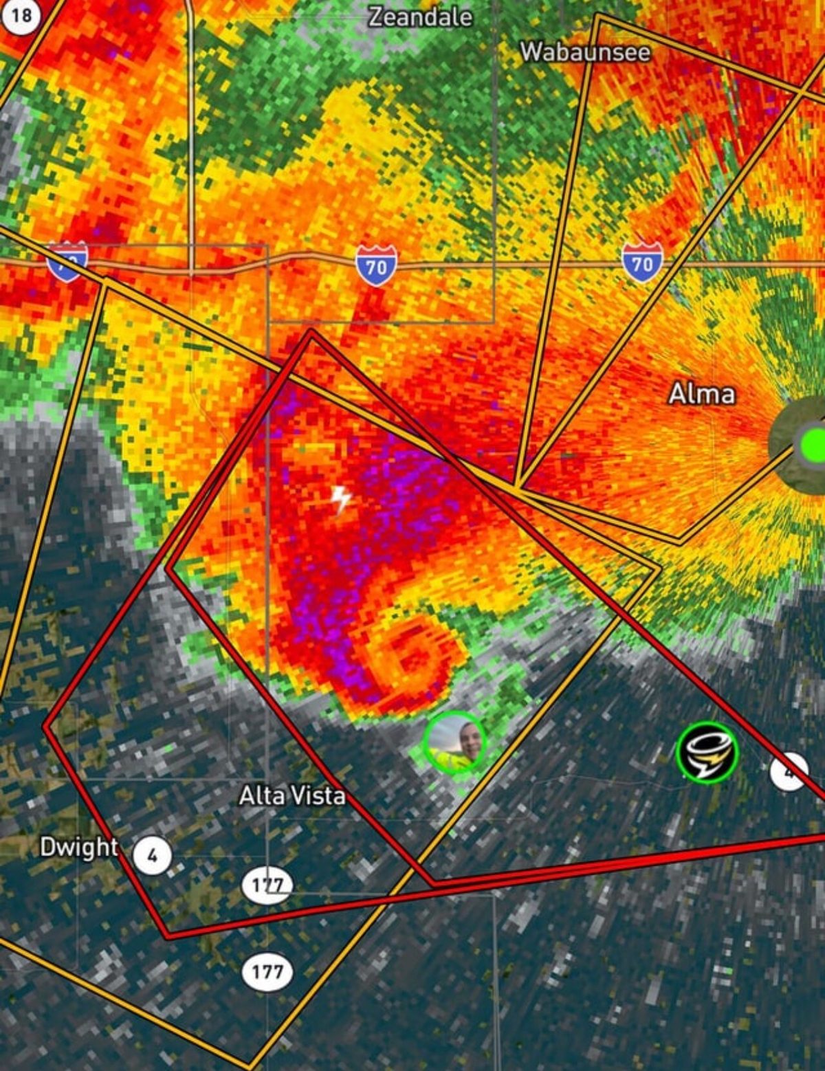 A ground weather radar reflectivity image of a thunderstorm, with a hooked appendage curling out from one side of the strongest echo.