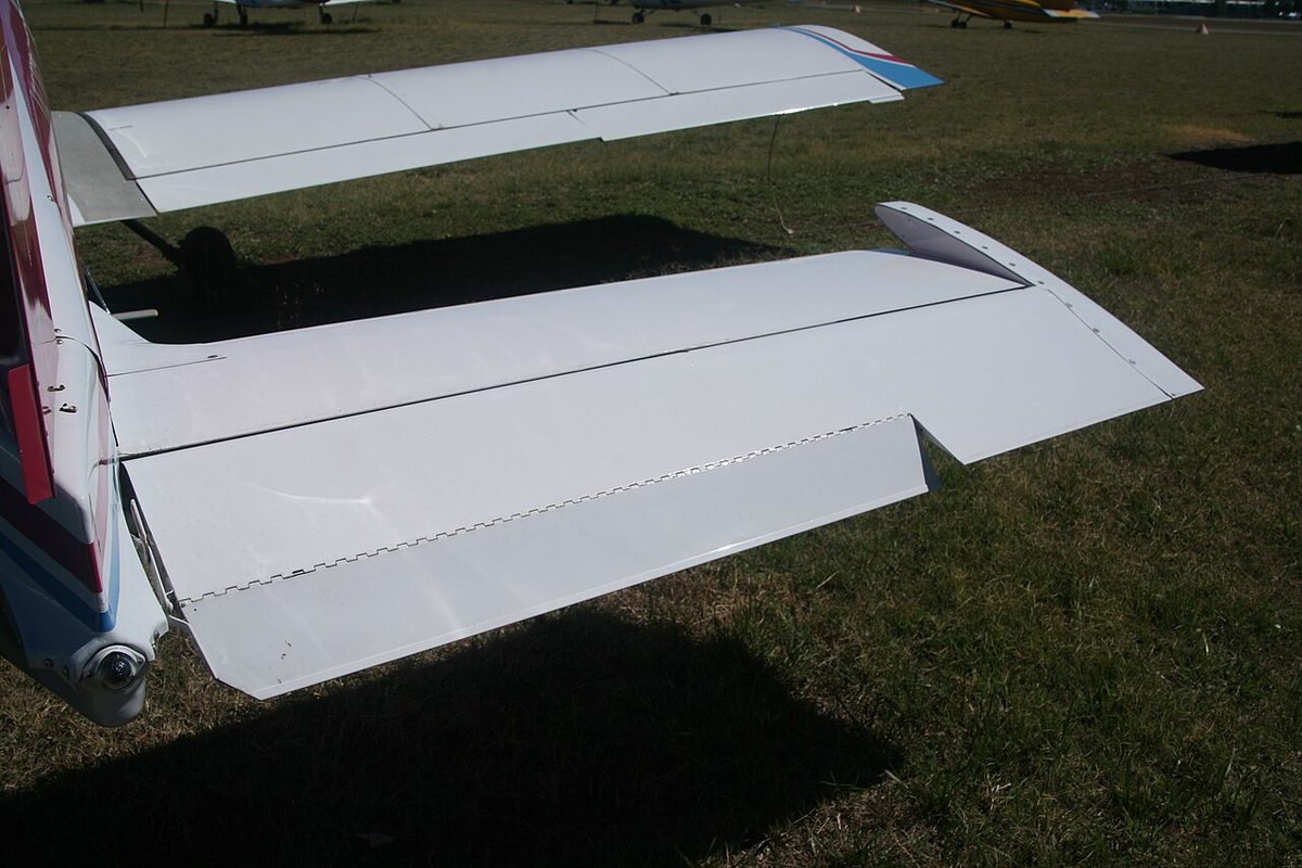 The right half of a light aircraft's tailplane from above, with the elevator along its rear edge and a small tab in the elevator's trailing edge.