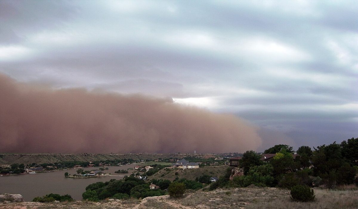 A towering wall of dust advancing across the landscape.