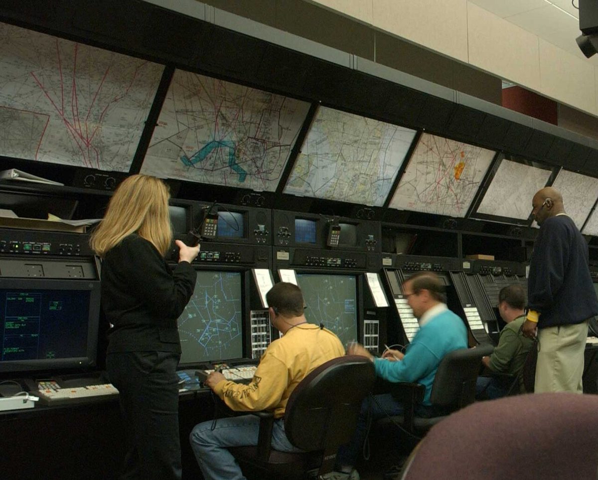 Air traffic controllers at their positions in the Washington Air Route Traffic Control Center.