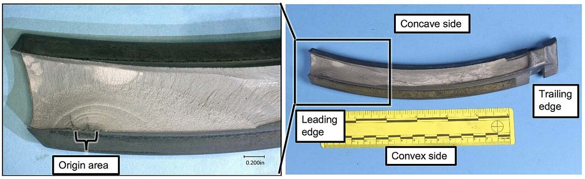 Close view of the fracture surface of a failed jet engine fan blade, from an NTSB investigation update.