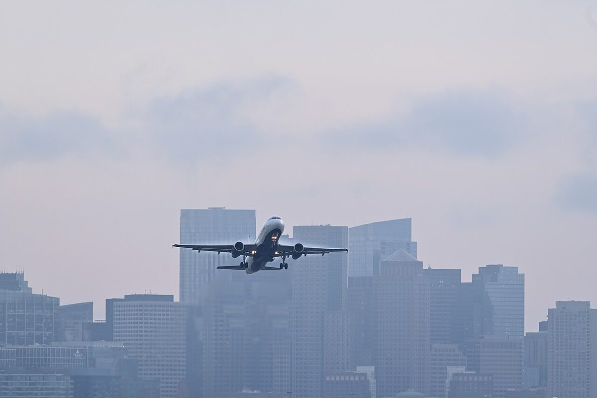 An Airbus A320 airliner taking off from a runway.