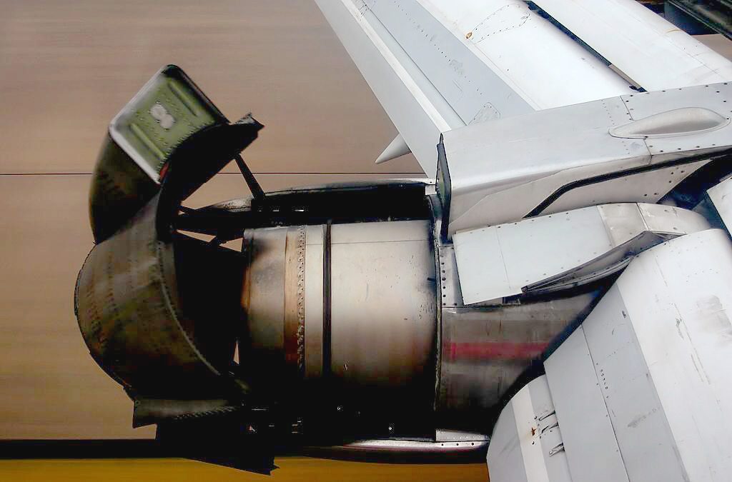 A Boeing 737-200 with its thrust reversers deployed.
