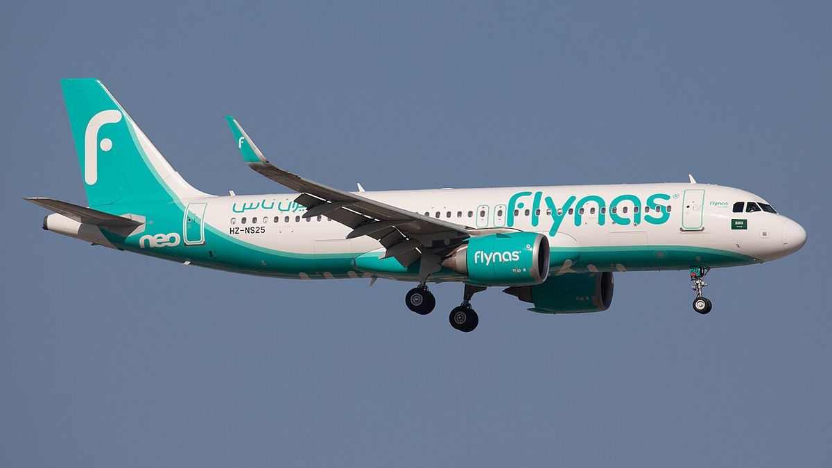 A flynas Airbus A320neo in its white and teal livery with its landing gear down.