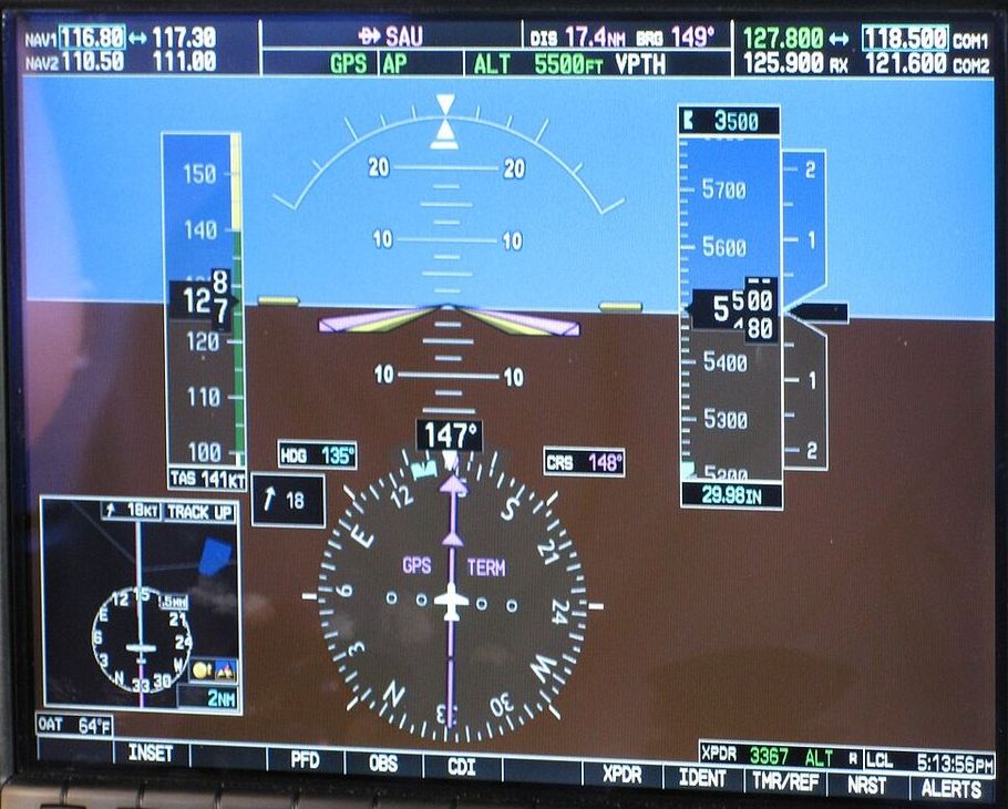 Glass primary flight display: airspeed tape on the left, altitude tape and vertical speed on the right, blue and brown attitude display, compass rose below.